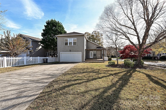 view of front of property with a garage and a front lawn