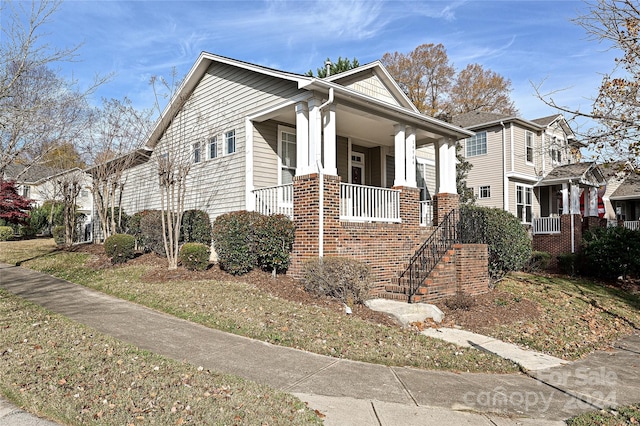 view of home's exterior featuring covered porch