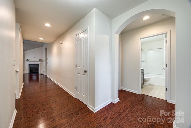 corridor with dark wood-type flooring