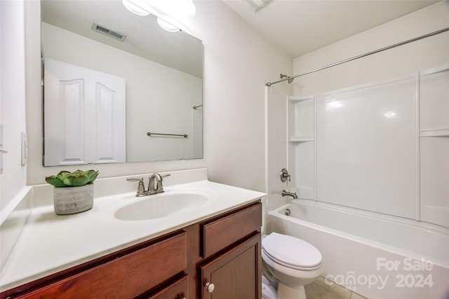 full bathroom with washtub / shower combination, tile patterned flooring, vanity, and toilet