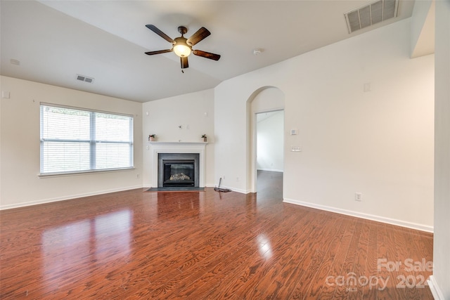 unfurnished living room featuring hardwood / wood-style flooring and ceiling fan