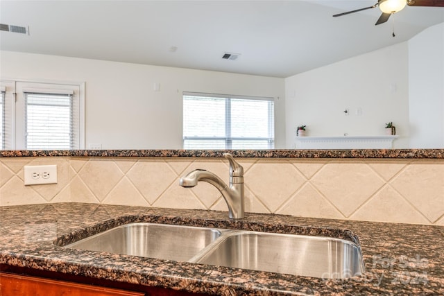 kitchen featuring ceiling fan, sink, and a healthy amount of sunlight