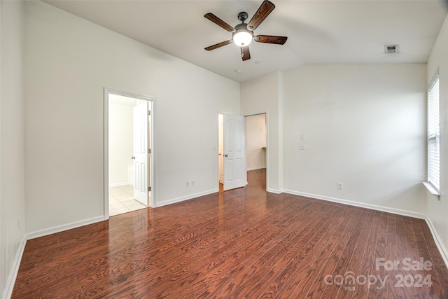 unfurnished bedroom featuring hardwood / wood-style floors, ceiling fan, and multiple windows