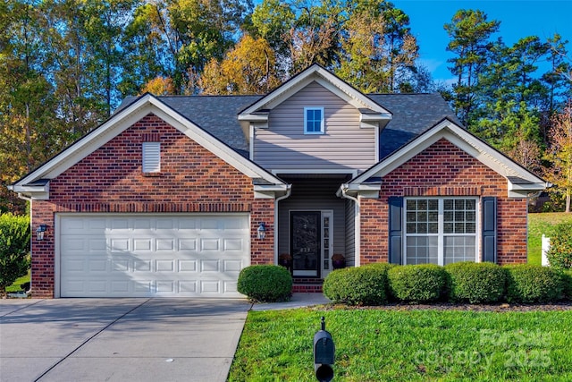 traditional home with driveway, brick siding, an attached garage, and a front yard