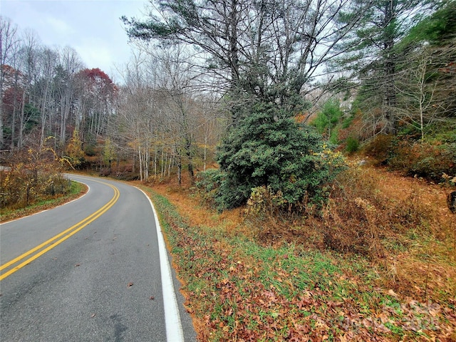 view of street featuring a view of trees