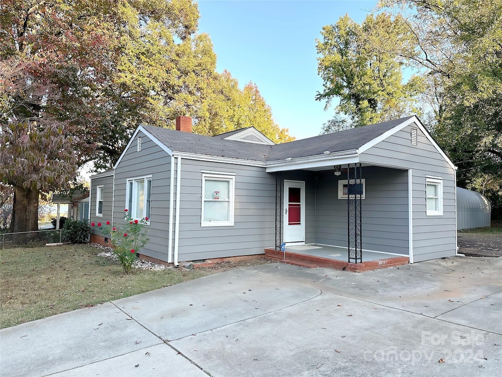 2310 Belfast Dr, Charlotte, NC 28208 - view of front of home with a chimney and a patio