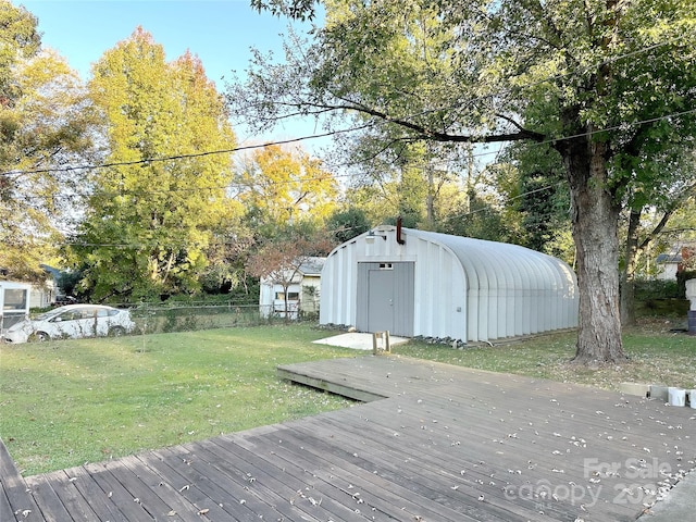 wooden deck with a yard and a shed