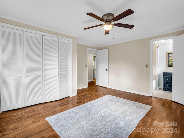 bedroom with hardwood / wood-style floors, ceiling fan, a closet, and crown molding