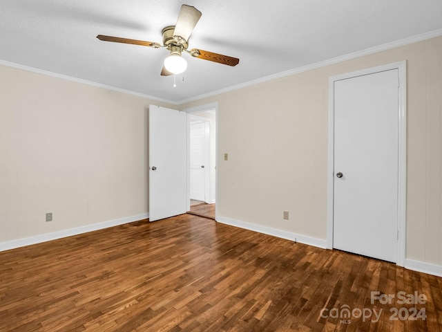 empty room featuring hardwood / wood-style floors, ceiling fan, a textured ceiling, and ornamental molding