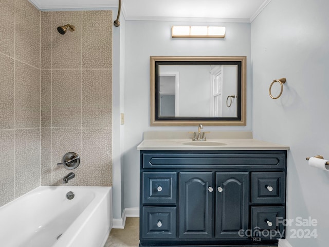 bathroom with vanity, tiled shower / bath, and ornamental molding