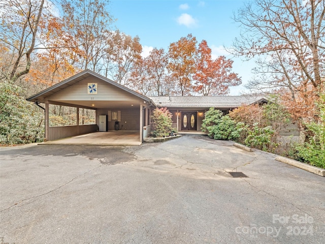 view of front of home with a carport