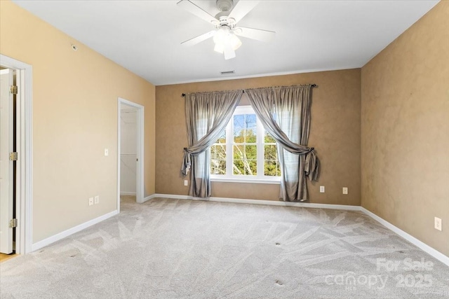 carpeted empty room with ceiling fan