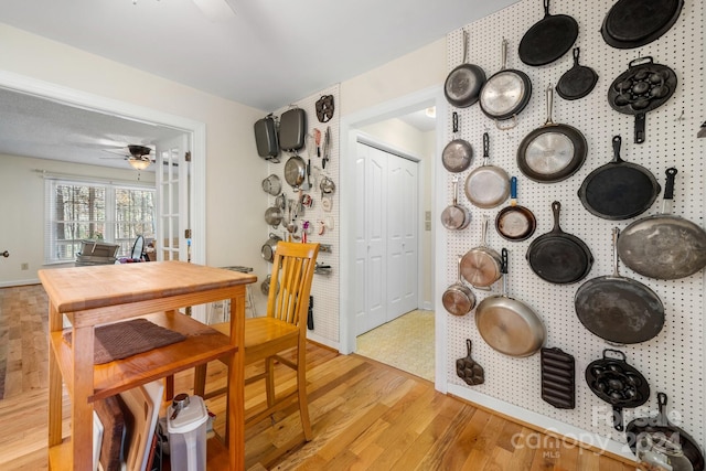 dining room with ceiling fan and light hardwood / wood-style flooring