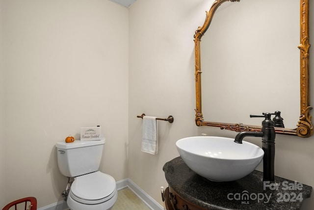 bathroom featuring toilet and sink