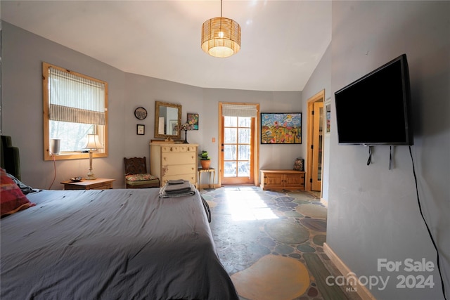 bedroom featuring lofted ceiling