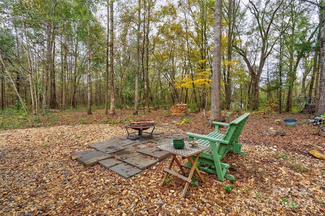 view of yard with a patio and a fire pit