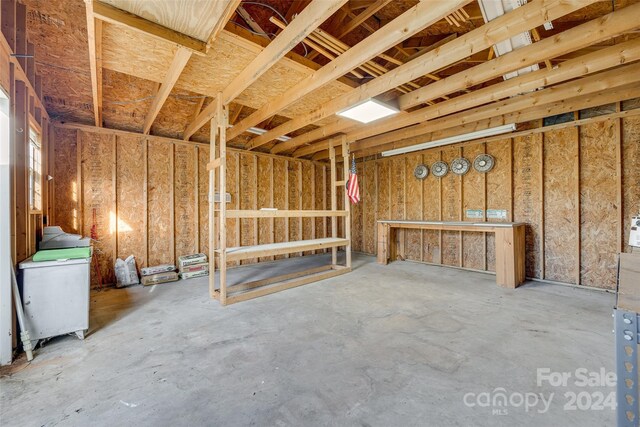 misc room with concrete flooring