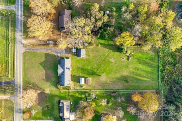 birds eye view of property featuring a rural view