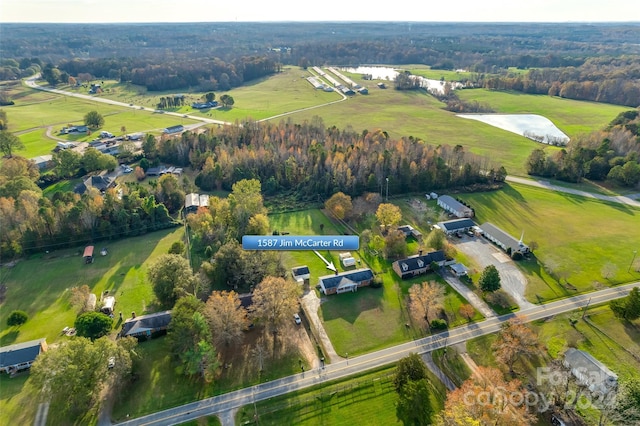 drone / aerial view featuring a rural view and a water view