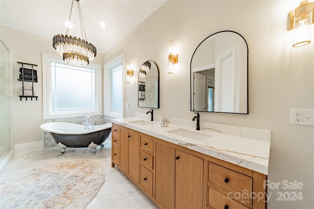 bathroom featuring a bathing tub, lofted ceiling, vanity, and an inviting chandelier