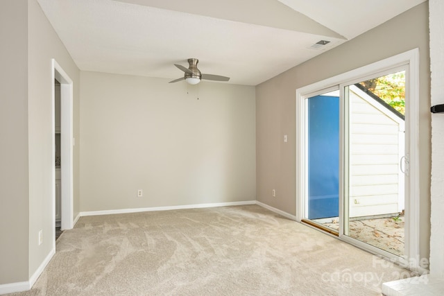 spare room featuring light carpet and ceiling fan