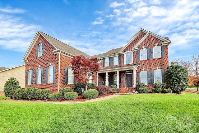 16404 Grassy Creek Dr, Huntersville, NC 28078 - colonial-style house with brick siding and a front lawn