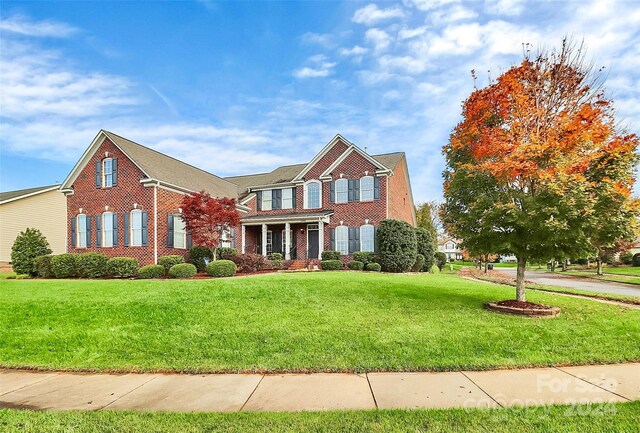 16404 Grassy Creek Dr, Huntersville, NC 28078 - view of front of property with brick siding and a front lawn