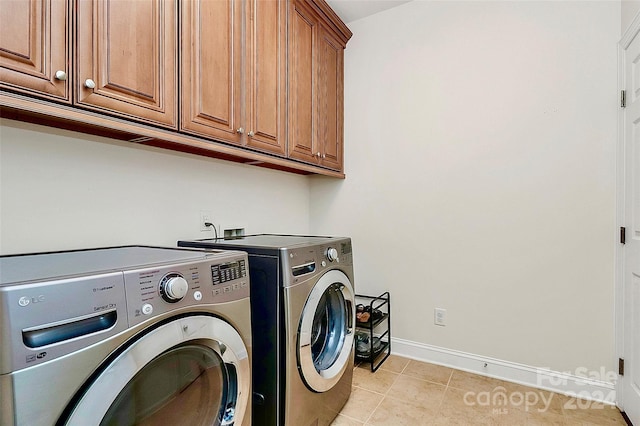 16404 Grassy Creek Dr, Huntersville, NC 28078 - clothes washing area with cabinet space, separate washer and dryer, baseboards, and light tile patterned flooring