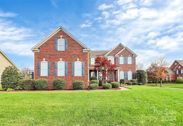 front facade with a front yard