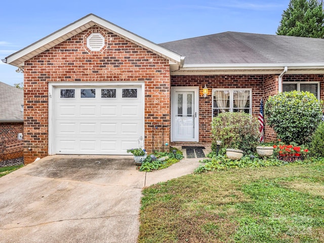 view of front facade with a garage and a front lawn