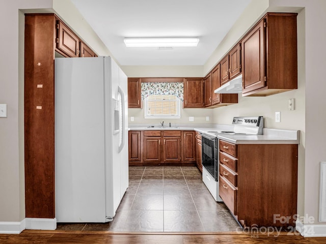 kitchen with white appliances and sink