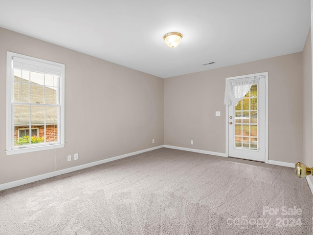 unfurnished room with carpet floors