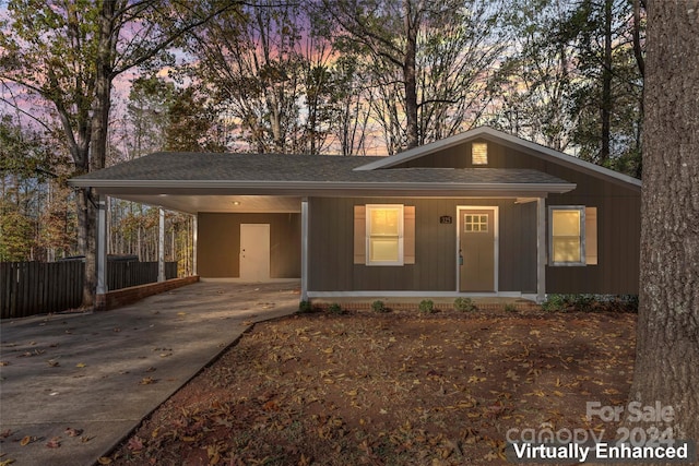 ranch-style house featuring a carport