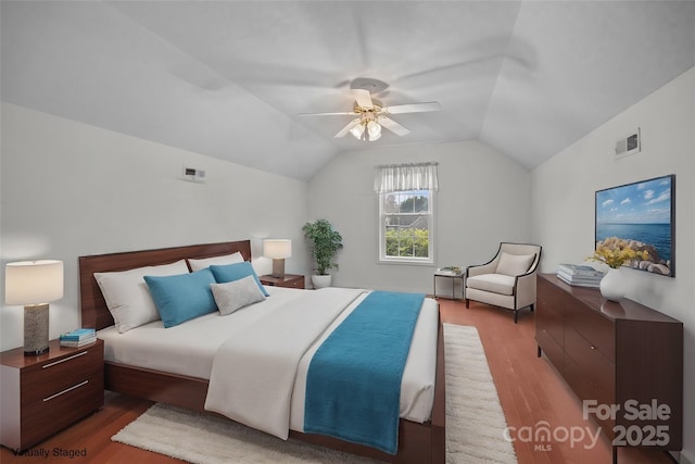 bedroom featuring lofted ceiling, ceiling fan, and hardwood / wood-style flooring