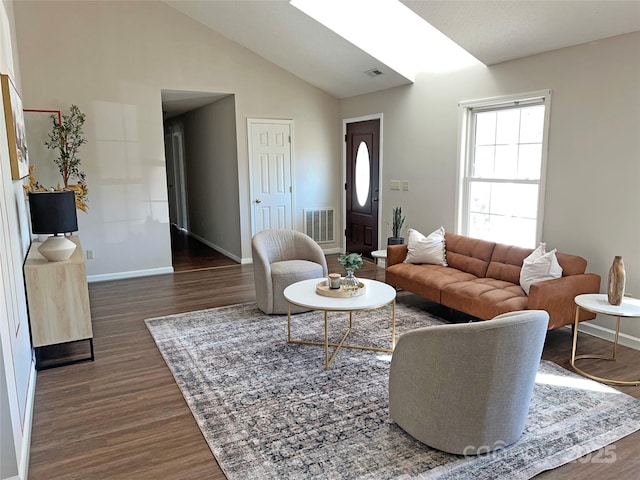 living room with lofted ceiling and dark hardwood / wood-style flooring