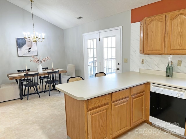 kitchen with kitchen peninsula, hanging light fixtures, a notable chandelier, tasteful backsplash, and black dishwasher