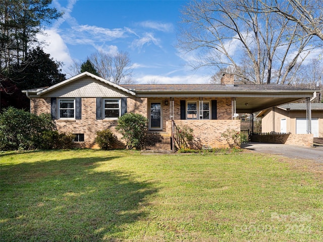 view of front facade with a carport and a front lawn