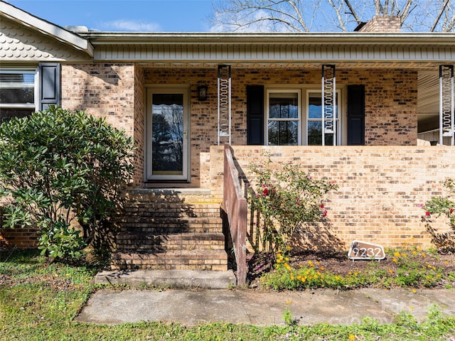 property entrance featuring covered porch