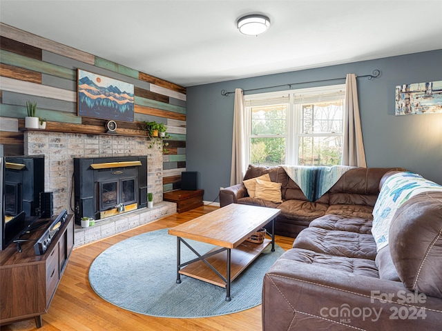 living room featuring wood walls and hardwood / wood-style flooring