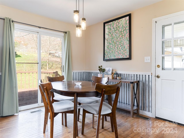 dining area with light hardwood / wood-style floors and plenty of natural light