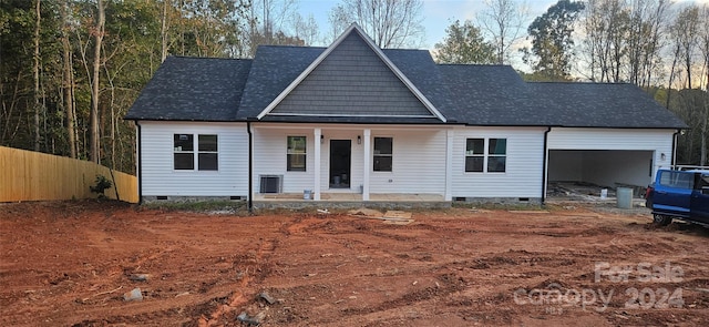 single story home with a porch and central AC unit