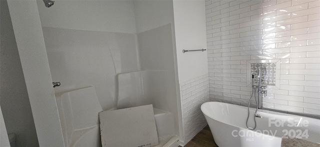 bathroom with plus walk in shower