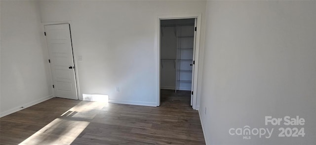 empty room with dark hardwood / wood-style floors