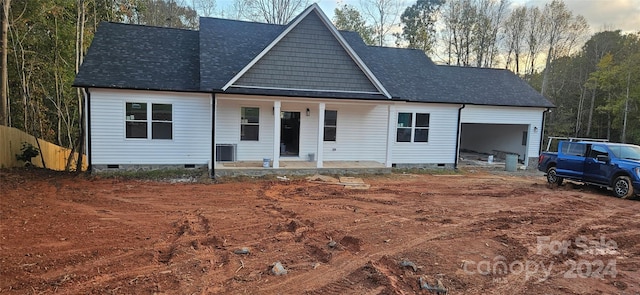 view of front of property featuring a porch and central air condition unit