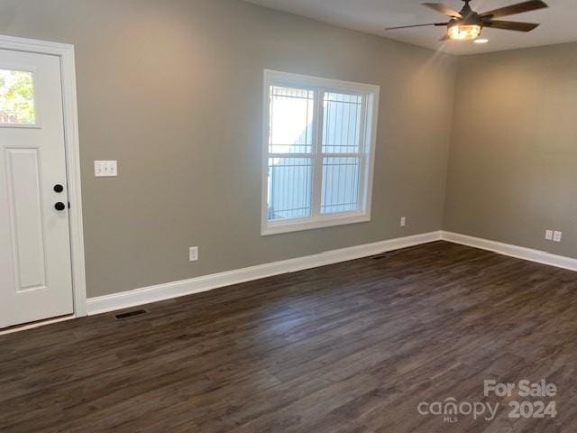 foyer with dark wood-type flooring and ceiling fan