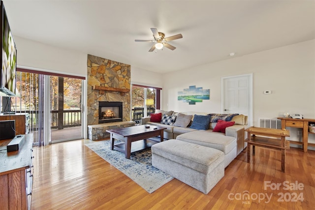 688 Olympic Dr Unit 2, Whittier, NC 28789 - living area featuring a ceiling fan, light wood-style flooring, and a fireplace