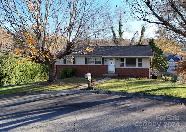 single story home with a front yard