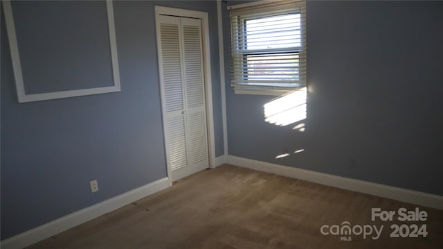 unfurnished bedroom with a closet