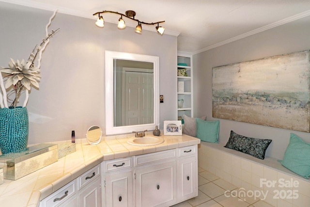 bathroom featuring vanity, tile patterned floors, crown molding, and built in shelves