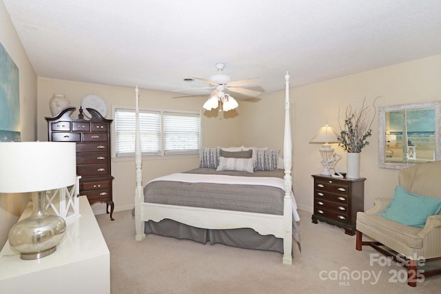 bedroom with ceiling fan and carpet flooring